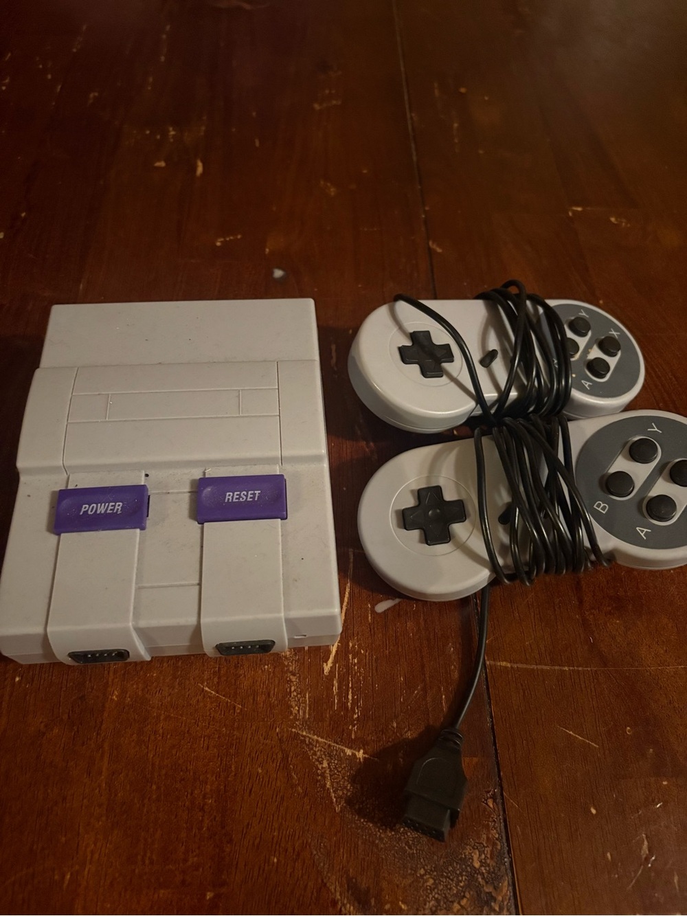 Nintendo Mini Gaming Console in Gray with Purple Buttons and Gray Controllers